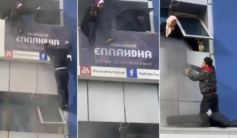 عالقون داخل مقر حزب النهضة التونسي يحاولون القفز من النوافذ هربا من الحريق (تويتر)