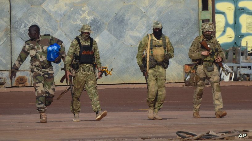 This undated photograph handed out by French military shows three Russian mercenaries, right, in northern Mali. Russia has engaged in under-the-radar military operations in at least half a dozen countries in Africa in the last five years using a shadowy mercenary force analysts say is loyal to President Vladimir Putin. The analysts say the Wagner Group of mercenaries is also key to Putin's ambitions to re-impose Russian influence on a global scale. (French Army via AP)