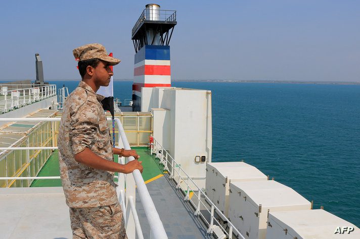 A picture taken during an organised tour by Yemen's Huthi rebels on November 22, 2023 shows a security guard aboard the Galaxy…